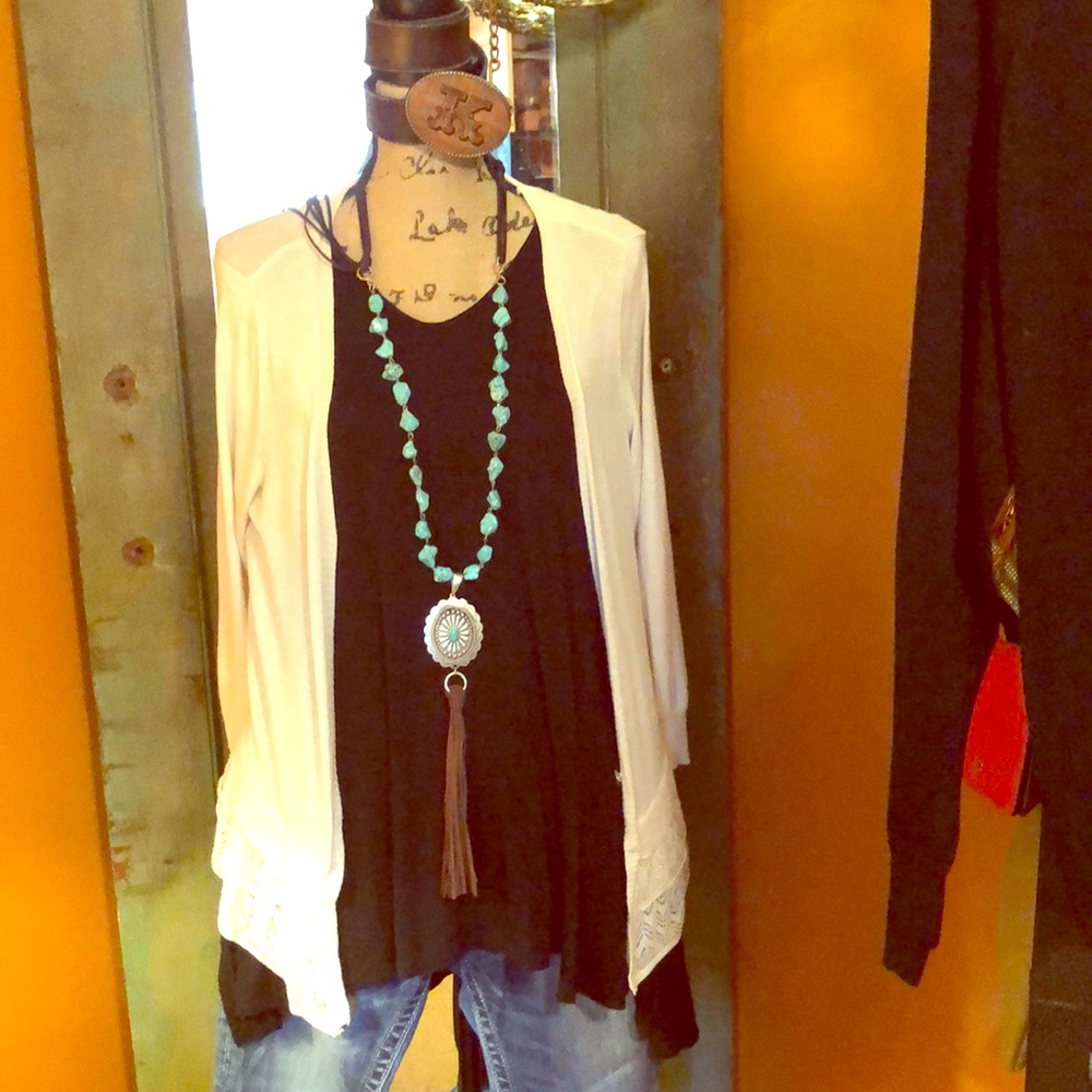 High low black top with 2 black/1 cream sweater